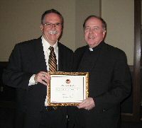K9HI receiving award at Boston College